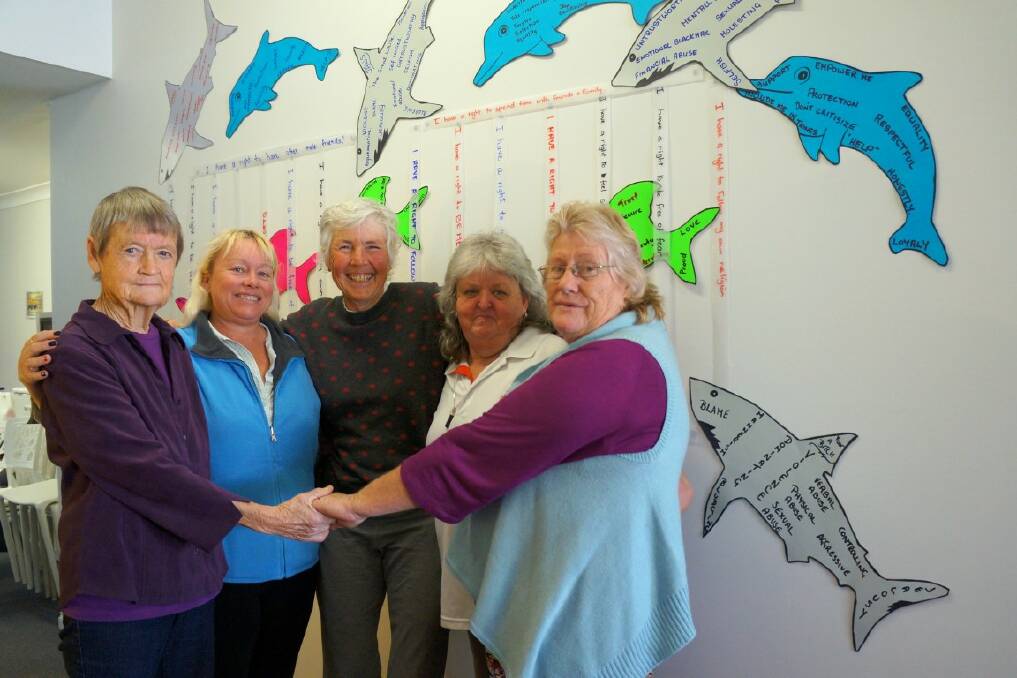 BOUNDARIES: Judith Arnott, Leonie Coleman, Anne Tink, Deidre Dwyer and Lynda Mallise with the shark cage they created.
