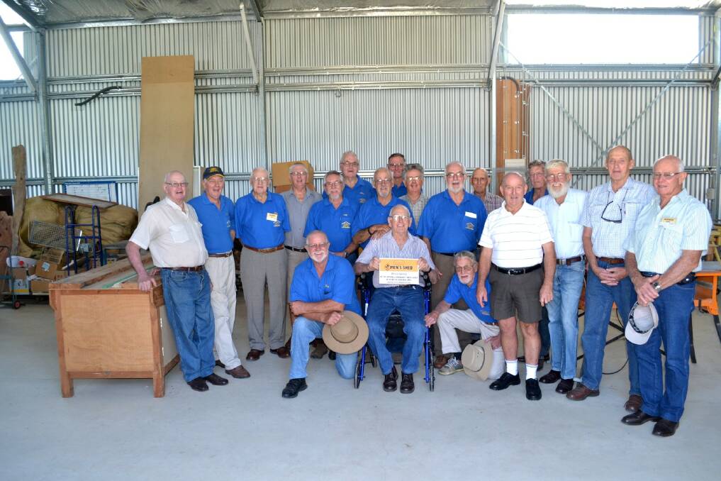 PROUD: Members if the Inverell Men's Shed stand in their new premises.