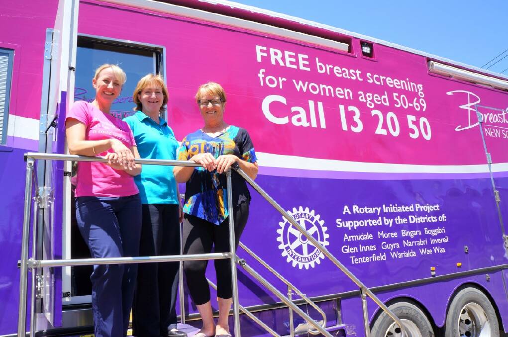 VIGILANCE: BreastScreen NSW staff Shannon Thompson and Janine O’Neill with client Marie Martin at the Inverell location for the bus.