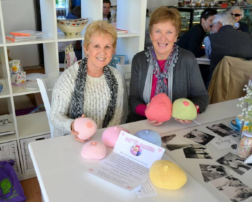 HELPING CANCER SURVIVORS: Inverell Breast Cancer group member Shirley Horwood, and president Jan O’Neill with a selection of knitted breast prostheses created by Shirley, in assorted sizes and colours.