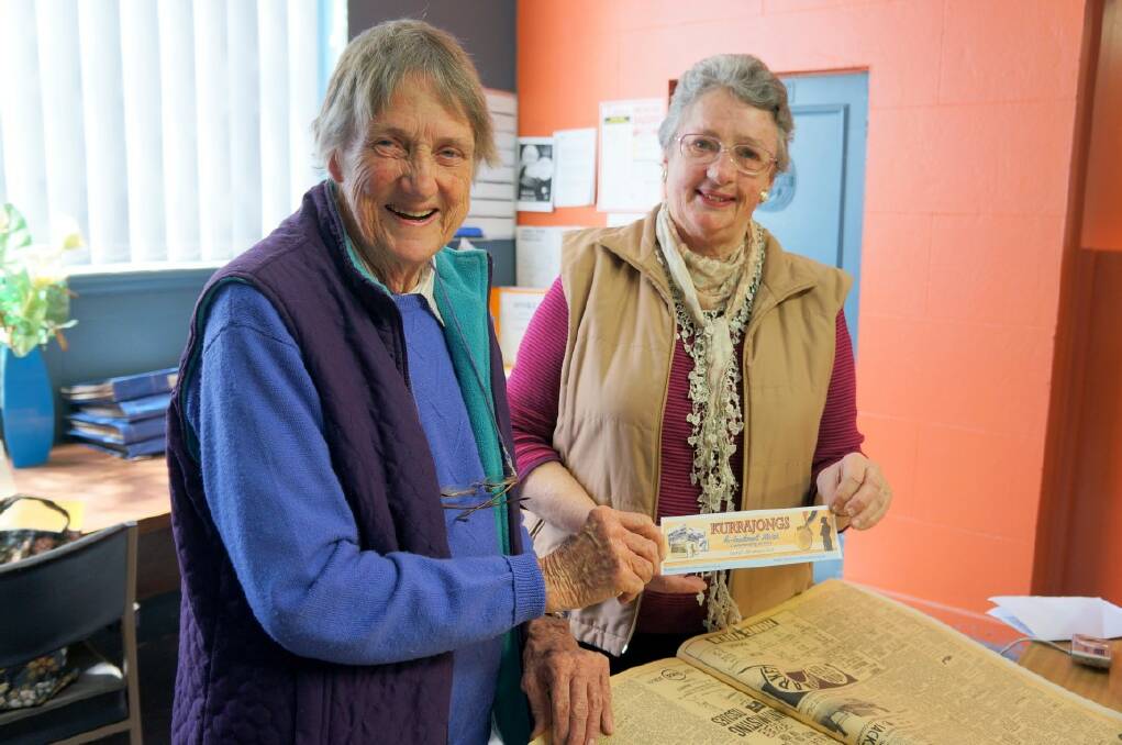 WAR HISTORY: Inverell Family History group members Julie Regan and Ann Hodgens with the bookmark detilaing the new web site information.
