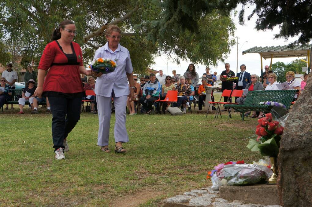 Philippa Raw and Lorna Olgilvie carried a wreath together to lay for the Delungra and District  Developmental Council. Pic 68