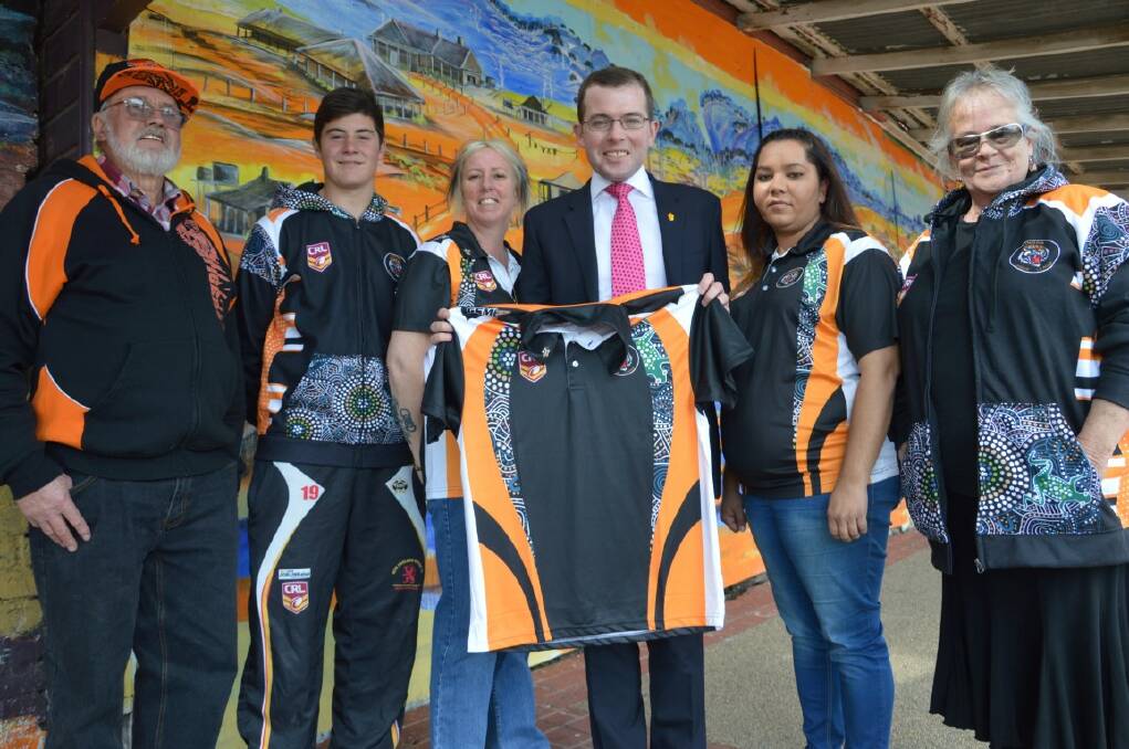 Tingha Minor League receives grant for female change rooms. Alf Byrnes (Tingha Minor League President), left, Brad Hickman (Tingha under 16s player), Sharon Gates (Committee member), Northern Tablelands MP Adam Marshall with a player’s shirt presented to him by the club, Miranda Morgan (Registrar and League Tag Coach) and Robyn Dixon (Committee member).
