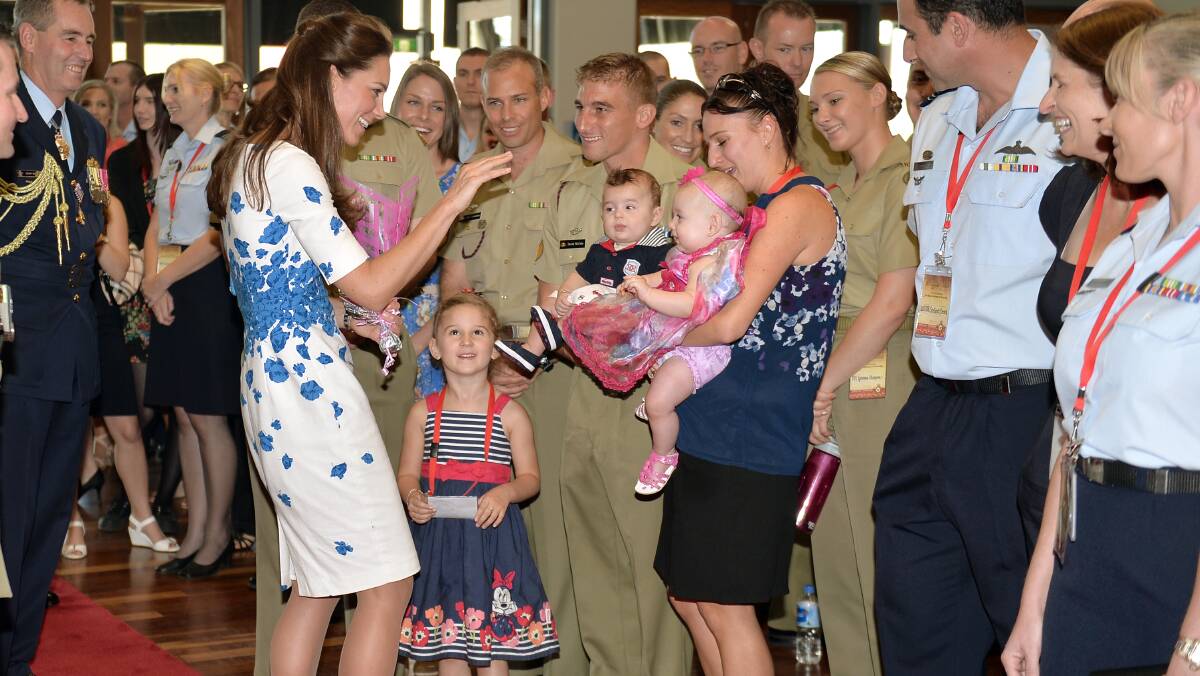 Catherine, Duchess of Cambridge meets baby twins Oscar and Alyssa McCabe as the Duke and Duchess of Cambridge visit RAAF base Amberley on April 19, 2014 in Brisbane, Australia. The Duke and Duchess of Cambridge are on a three-week tour of Australia and New Zealand, the first official trip overseas with their son, Prince George of Cambridge. Photo: Anthony Devlin - Pool/Getty Images.
