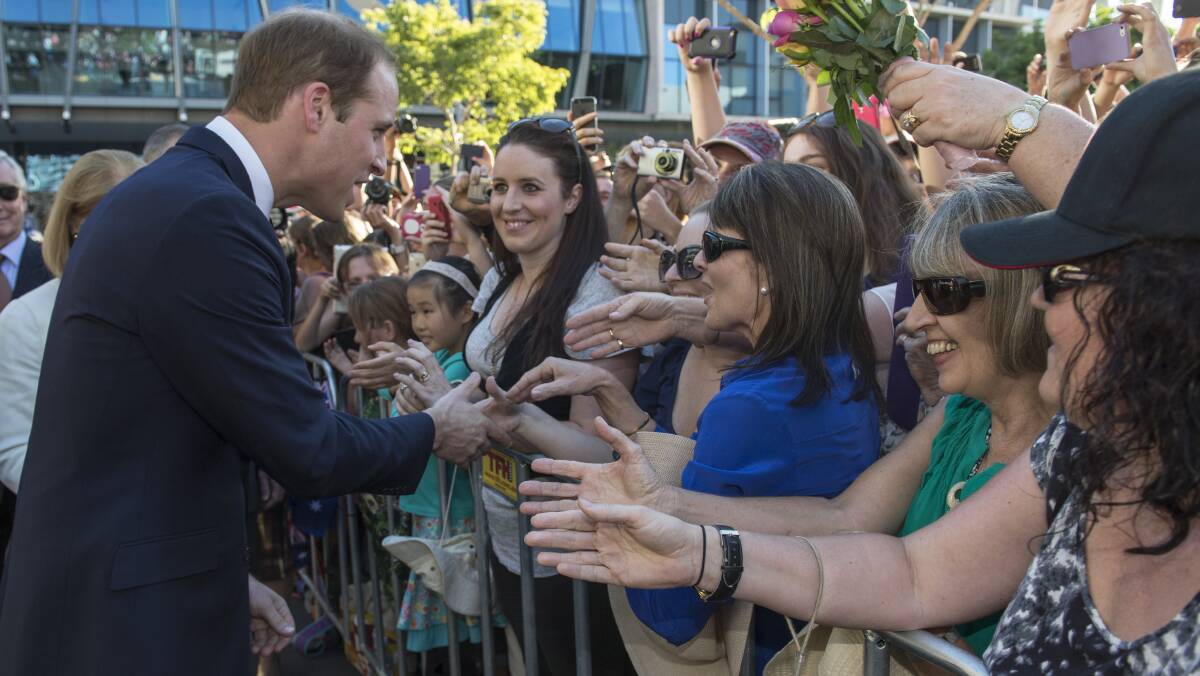 Prince William, Duke of Cambridge meets well wishers during a walkabout on April 19, 2014 in Brisbane, Australia. The Duke and Duchess of Cambridge are on a three-week tour of Australia and New Zealand. Photo: Arthur Edwards - Pool/Getty Images.