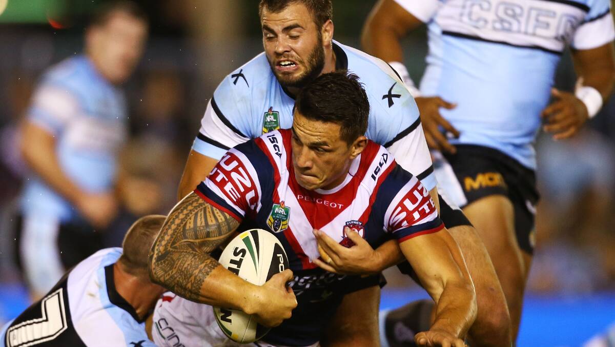 Sonny Bill Williams of the Roosters is tackled during the round seven NRL match between the Cronulla-Sutherland Sharks and the Sydney Roosters at Remondis Stadium on April 19, 2014 in Sydney, Australia. Photo: Mark Nolan/Getty Images.