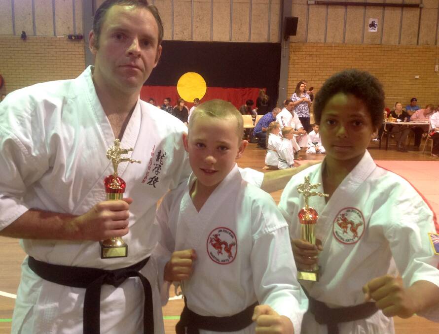 L-R Charles Baker, winner of the senior men's kata and two of his students, Troy Carter and Sam Dillon (10-11 years kata) from Inverell.