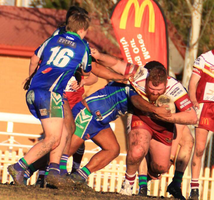 Hitting the line: Hawks front-rower Brendan Critchlow doing the hard yards against the Rams.