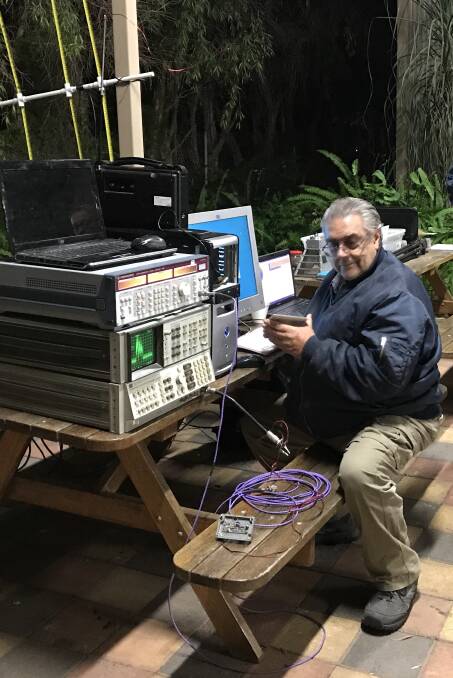 TUNED IN: Barry Gilbert demonstrating some of his home-built radio astronomy equipment at TRAC's Stargazing Tamworth event held in July. Photo: Margie Schofield