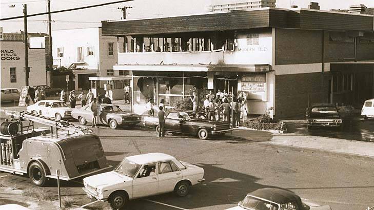 Fifteen people dead: Onlookers mill outside the shell of Brisbane's burnt-out Whiskey Au Go Go in March 1973.