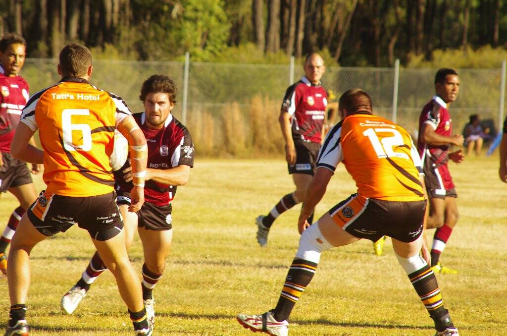 DEFENCE: Inverell’s Luke Fenton prepares to take on the Tingha Tigers defence during Saturday’s clash. The Tigers won 26-6.                                                         PHOTO by JACKIE WATKINS