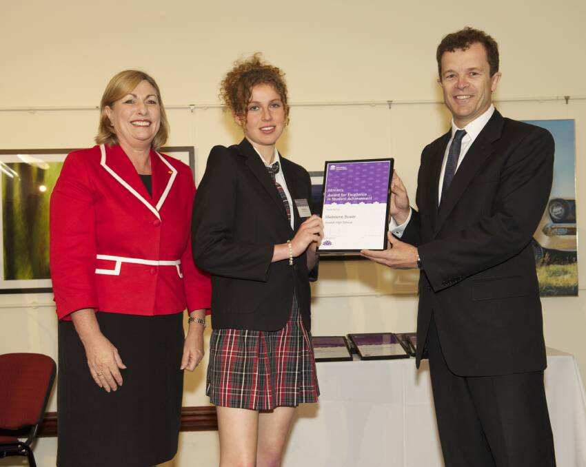 Madeleine Bower accepts the award from the Director-General of the Department of Education and Communities, Michele Bruniges and Parliamentary Secretary for Tertiary Education & Skills, Mark Speakman.