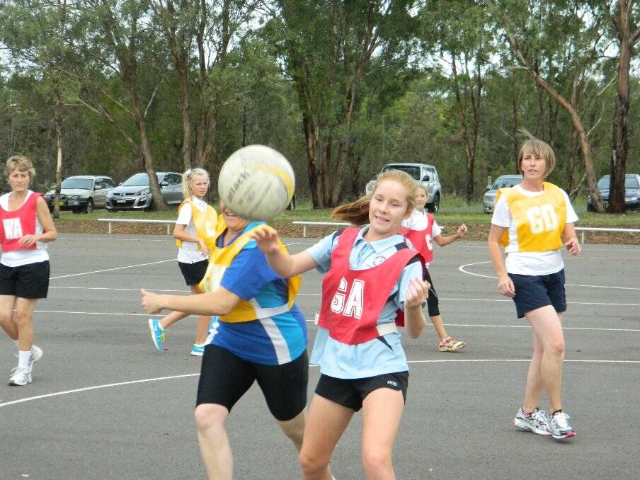 FUN: Some of the girls enjoying themselves during the twilight netball competition.  