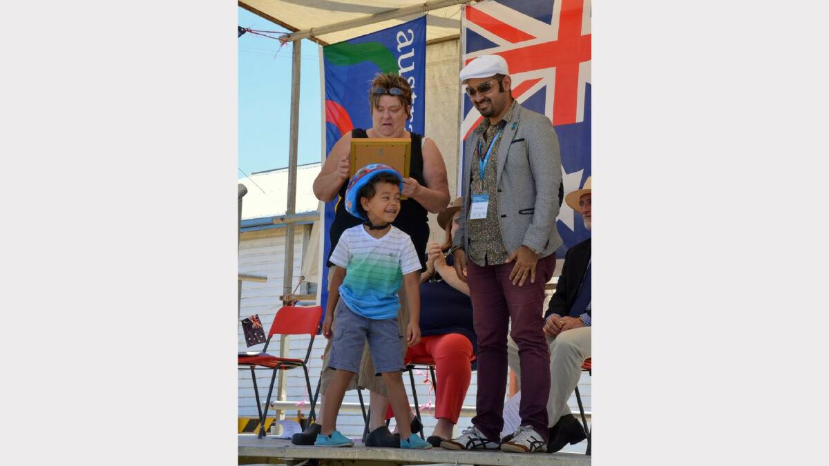 Delungra's Citizen of the Year Janice Pollock was photobombed by grandson Epalahame Vea while Joseph Tawadros had a chuckle.