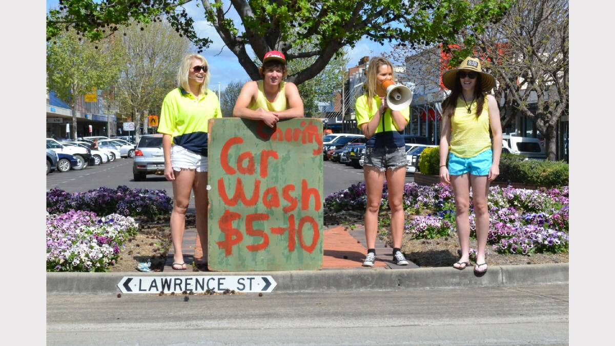 Inverell High School year 12 students raised a record-breaking $11,356.59 for three area charities, in 2013. The car wash was a popular activity in November. Here, Brittany Walters, Brock George, Ashley Rafter and Izzy Hampton did their bit to direct cars to the students’ car wash.
