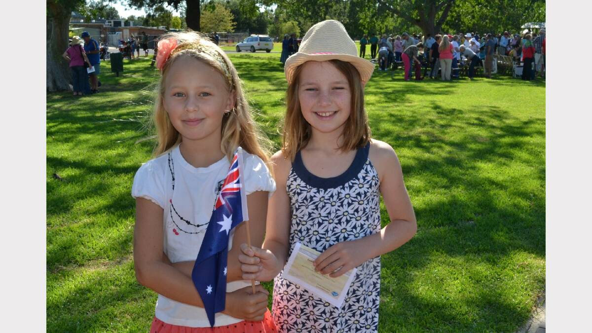 Charlotte and Alice McInnes with a flag.
