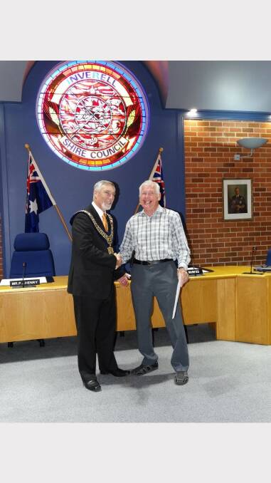 Mayor Harmon congratulates Kenneth WIlliams.
