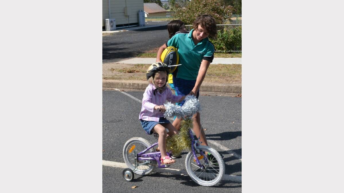 River Melia gave his little sister a hand during the Delungra parade.