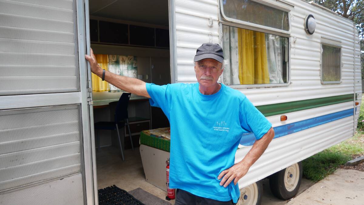 NO HOLIDAY JOY: Michael Brosnan stands outside one of the Social Justice Advocate's caravans that will need to be removed from a caravan park for the summer holidays. 
