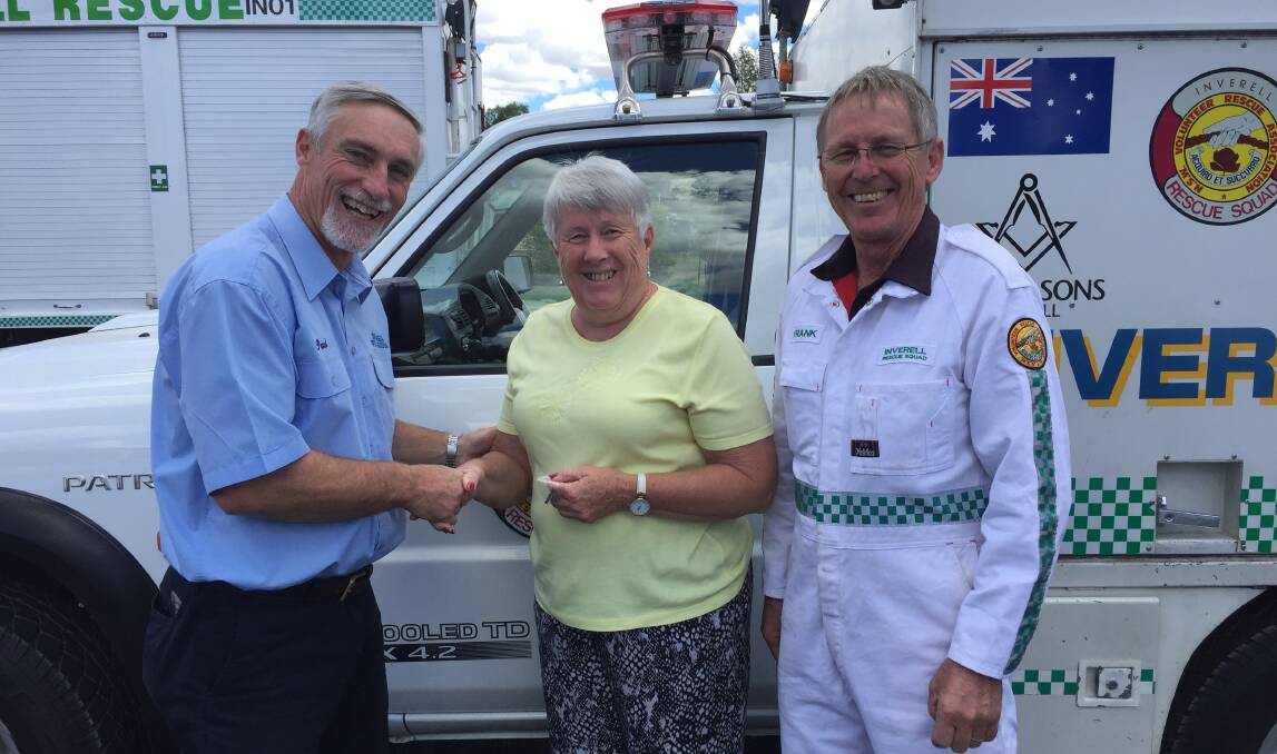 SUPER SERVICE: Mayor Paul Harmon presents Christine Clark with her badge for 35 years of service with Frank Fleming, president of the Inverell Rescue Squad (VRA). Members will be holding a dinner at the Sporties on Saturday February 22, commencing at 6.30pm.