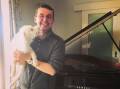 Owner and operator of Heirloom Pianos, Ben Taylor, with his Schnoodle, Edie. Picture supplied