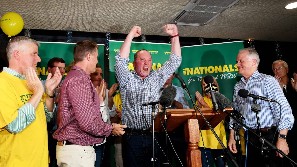 Cheers: Barnaby Joyce celebrates his by-election victory in Tamworth on Saturday night. Photo: Gareth Gardner.