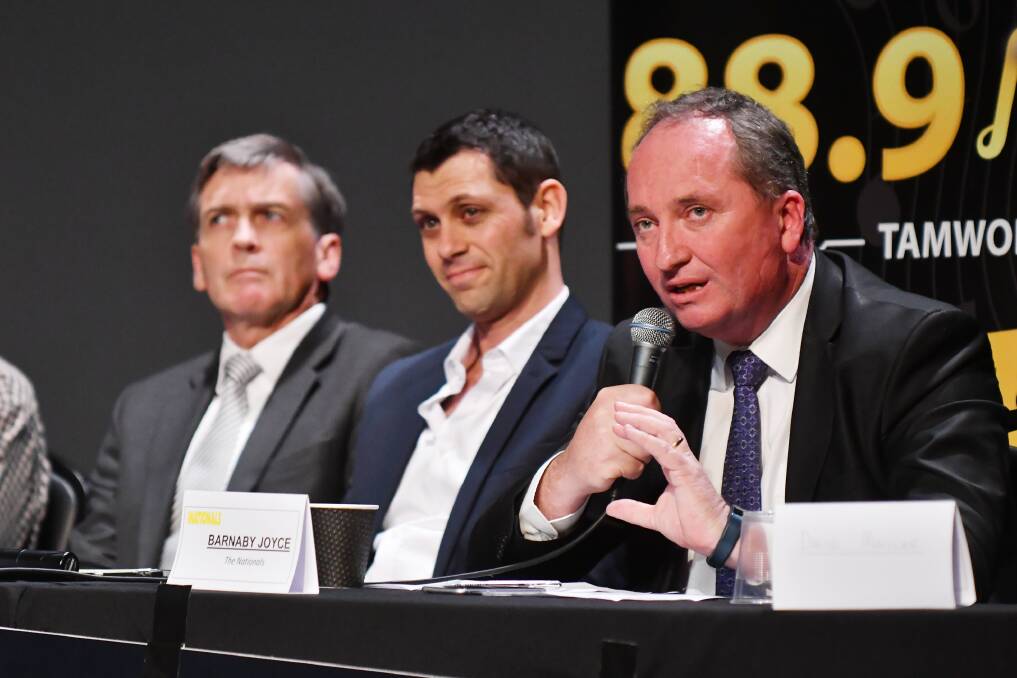 NOT THIS TIME: Barnaby Joyce and Labor's David Ewings go head-to-head at public debate last year. Photo: Barry Smith