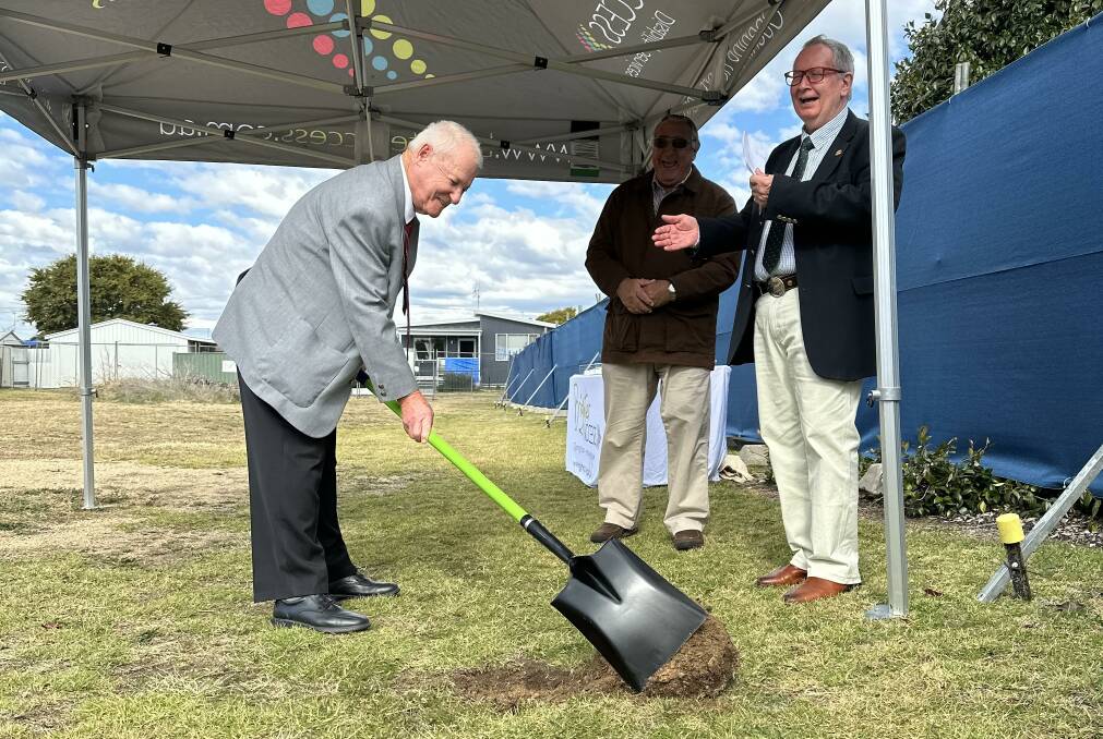 Brighter Access board chairman John Scoble breaks ground during the soil turning ceremony last week, as councillor Stewart Berryman and Brighter Access board member David Maddigan cheer him on. Picture supplied