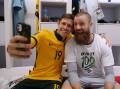 Celebration: Socceroos goalkeeper Andrew Redmayne (right) with fellow player Craig Goodwin after the victory.  
