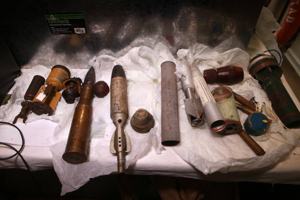 The collection included explosive projectiles used in a rocket launcher, hand grenades, mortar shells, live rounds and other ordnance. Picture: Sylvia Liber
