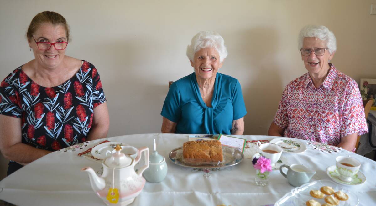 Dot Stokes, Elaine Maslen and Leonie Benson enjoy a cuppa, a slice of cake and a chat. Photo: Anne Keen