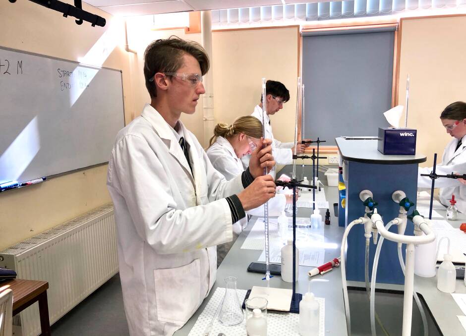 OFF THE CHARTS: Inverell's Harry Schneider (left), and fellow TAS students Isabel Newton and Samuel Ball on their way to winning the NSW Schools Titration Competition. Photo: Supplied