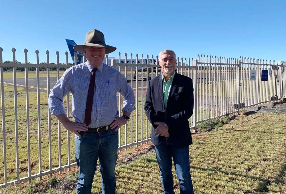 SKY HIGH: MP Barnaby Joyce and Inverell mayor Paul Harmon at the Inverell Airport, welcoming the completion of new fencing. Photo: Supplied