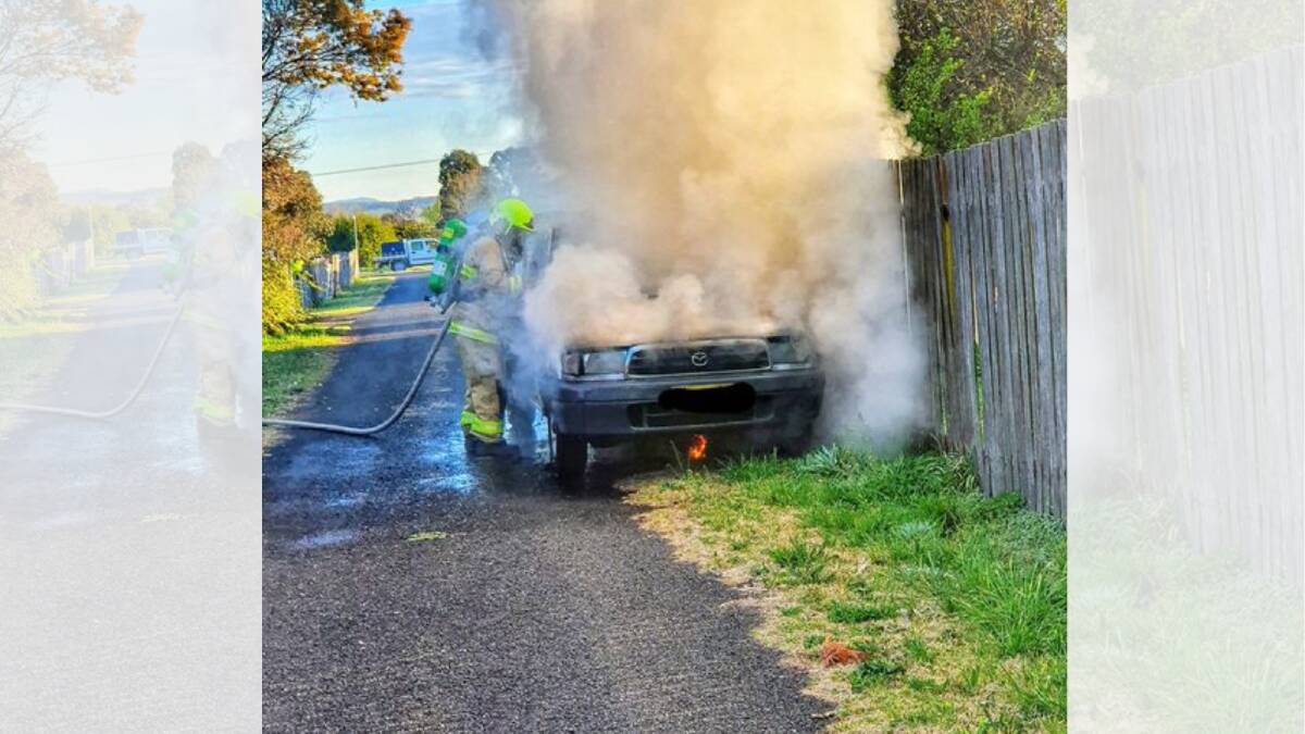 Crews' quick work stops car fire spreading to timber fence