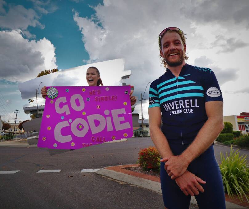 FANS: Codie Miller was supported by friends at the finish line, like Rachel Leonnard, who made fan signs to cheer him on. Photos: Jacinta Dickins