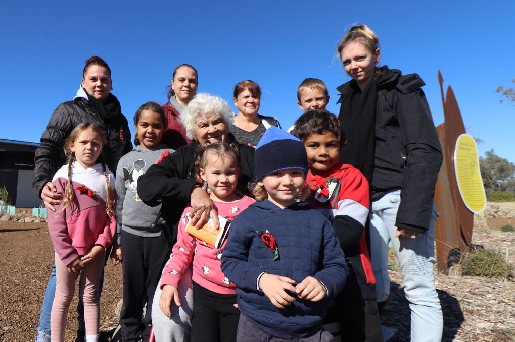 FAMILY: Priscila Harrison (centre) pictured with her daughter Renae Semple and grand-daughter Vicki Paton to her left and right, surrounded by her great, and great-great, grandchildren at Myall Creek Memorial on Sunday. Photo: Jacinta Dickins