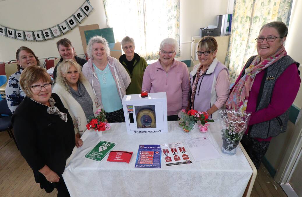 PEACE OF MIND: Lorraine Brown, Marie Martin and Sister Coral Hedley, from right, with ladies from the Women's Shed around the new defibrillator. Photo: Jacinta Dickins