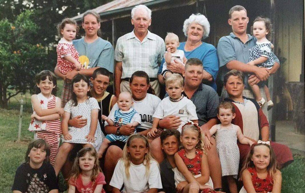 RIP: The late Betty Joan Cook with husband Cedric and their 21 grandchildren. Photo: supplied