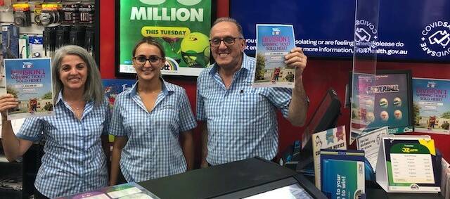 An excited Rosy and Anthony Michael with Inverell Newsagency staff member Chelsie