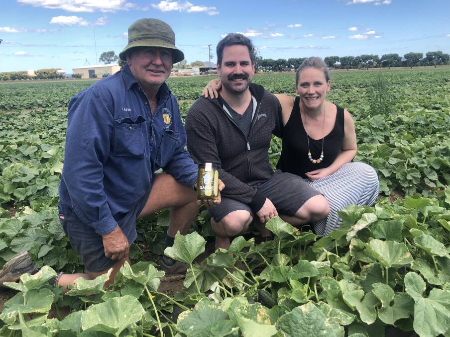 PADDOCK: Pickle grower Laurie Land, Gumlu, Qld with Dillicious founders James and Liza Barbour, Melbourne, Vic, on the farm inspecting the crop. 