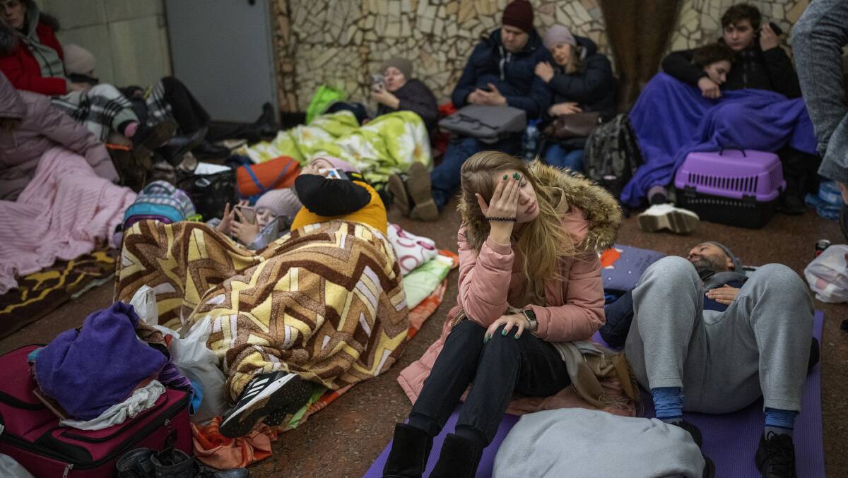 People rest in the Kyiv subway, using it as a bomb shelter in Kyiv, Ukraine. Photo: AP Photo/Emilio Morenatti