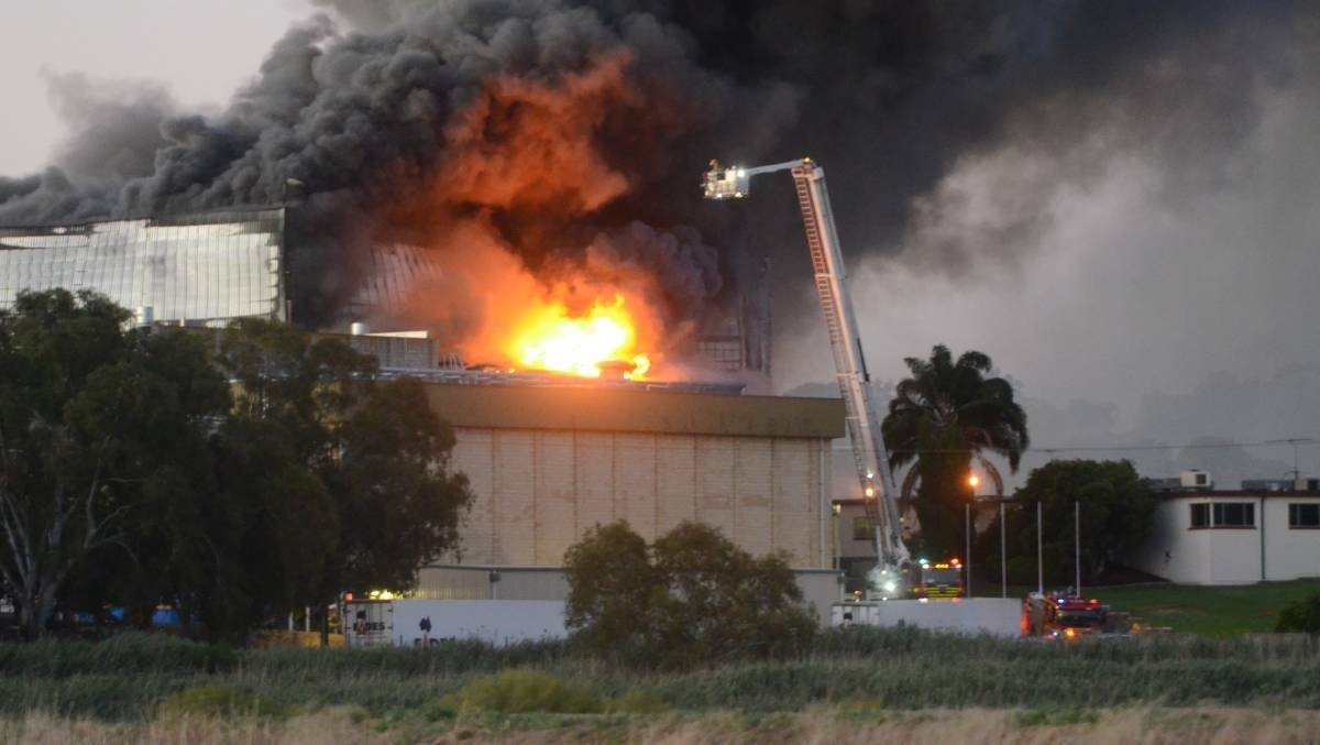 BLAZE: The fire burns at Thomas Food International's Murray Bridge abattoir last week. Photo: Peri Strathearn