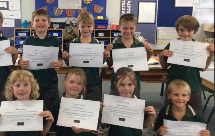 REWARDS FOR THE DEVELOPMENT OF SKILLS: K-2 scientists are proud of their achievements.