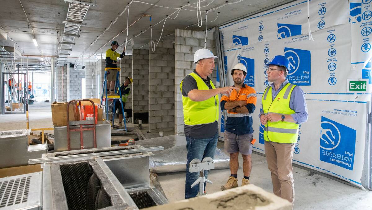 Inverell Police Sergeant Ross Chilcott, left, Project Manager Damien Mills and Northern Tablelands MP Adam Marshall inspecting construction progress on the new $16 million Inverell Police Station.