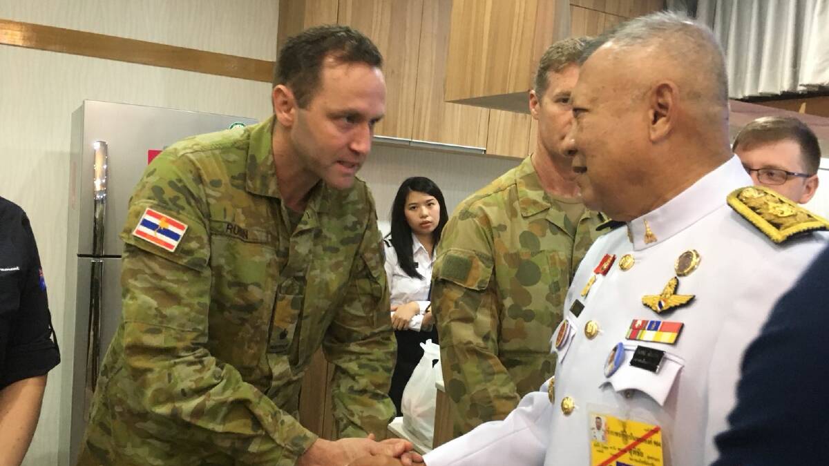A senior official representing the King of Thailand thanks Major Rubin and the rest of the Australian Team at the airport before they depart.