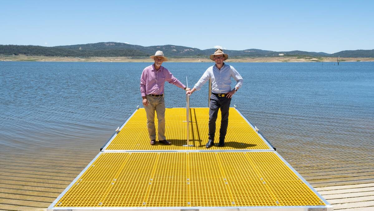 Inverell Shire Mayor Paul Harmon and Northern Tablelands MP Adam Marshall inspect the new floating pontoon at the bottom of the new 440-metre concrete boat ramp  the longest in the Southern Hemisphere  at Copeton Dam Northern Foreshore last Friday.