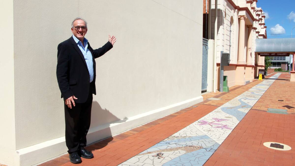 Deputy mayor Anthony Michael in front of the blank canvas in Evans Street.