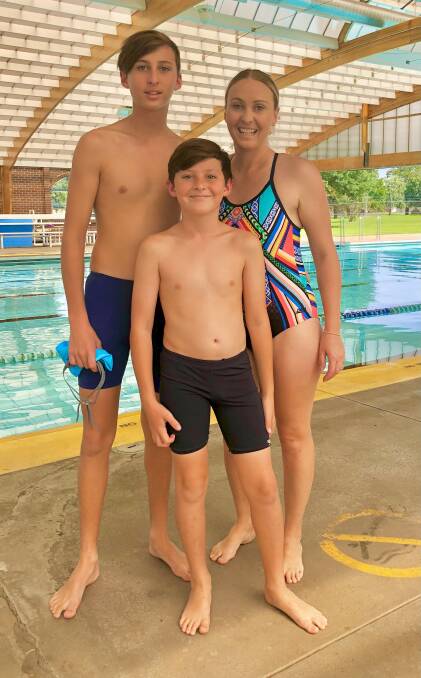 Toni Ribero with sons Hunter and Aiden at the pool.