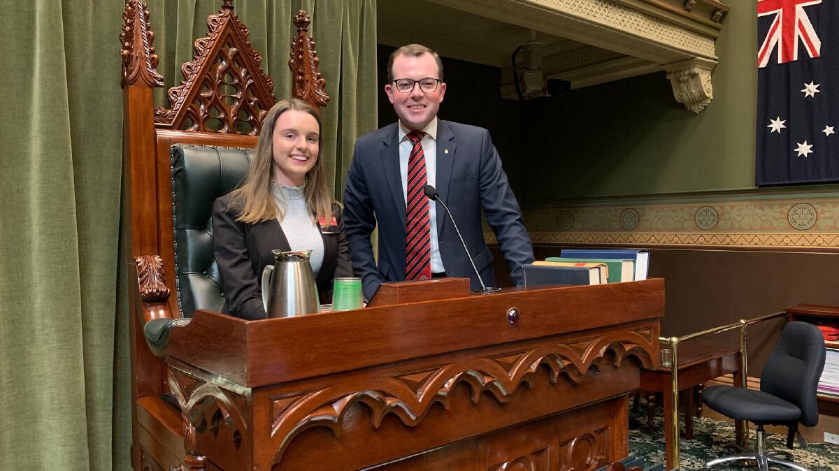 Imogen McDonald as the Northern Tablelands Youth MP in 2019, siting in the Speakers Chair alongside her senior counterpart Adam Marshall.