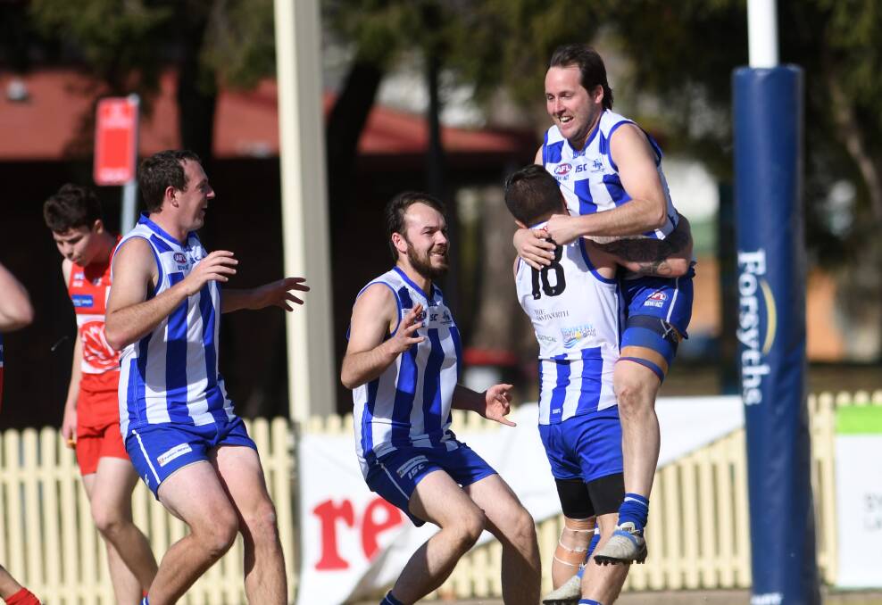 CHAMPION: Roos forward Dan Overeem celebrates a goal against the Swans. He took his career goal tally to 1003 in his 300th game. Photo: Gareth Gardner 